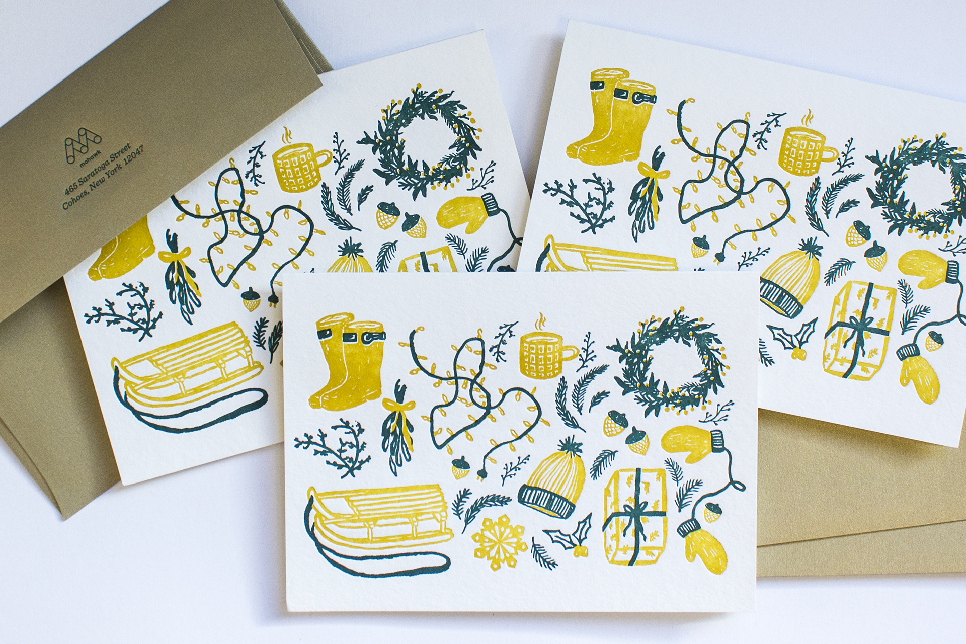 Three holiday cards with envelopes