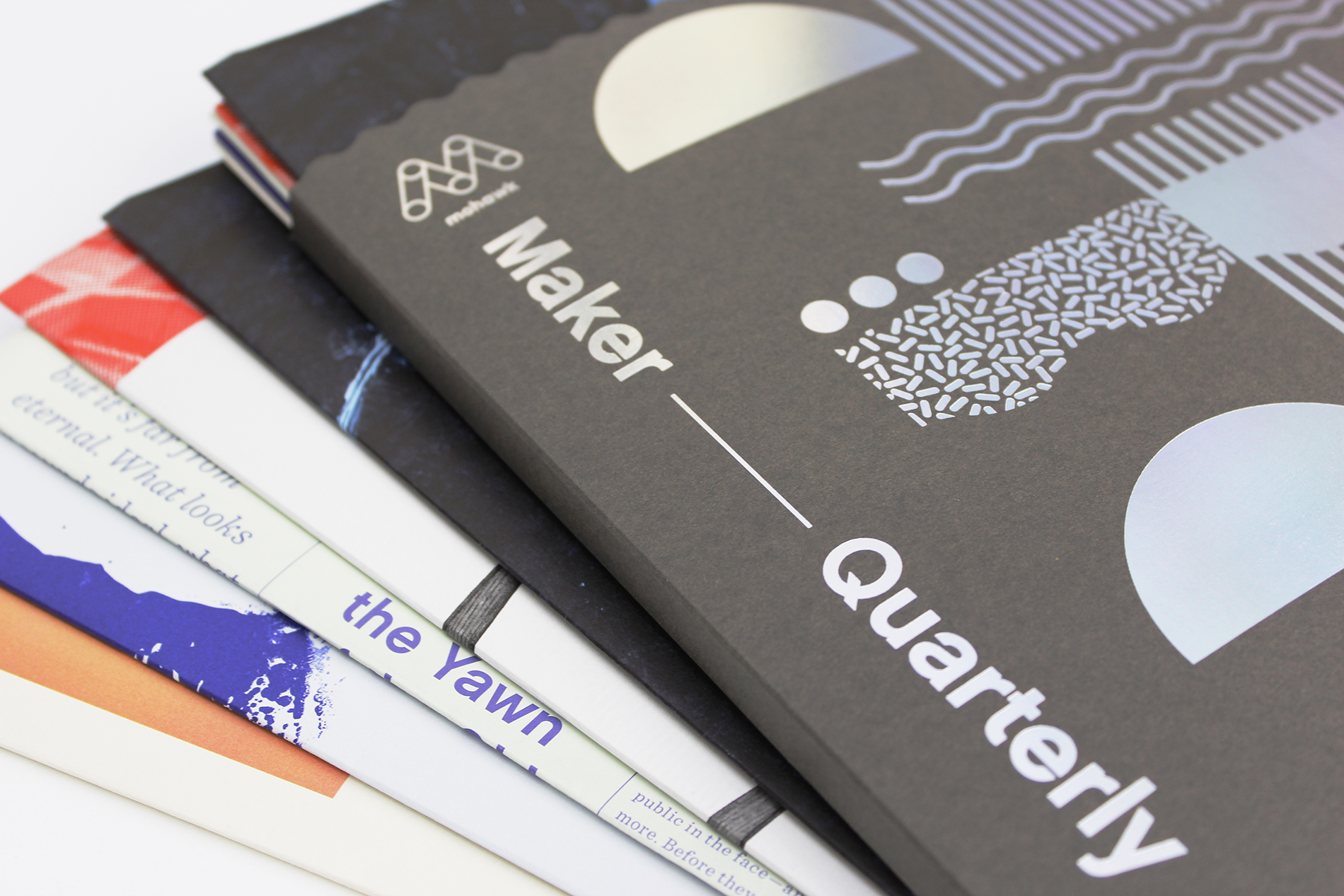 Maker Quarterly 10 and its contents laid out in a fan arrangement