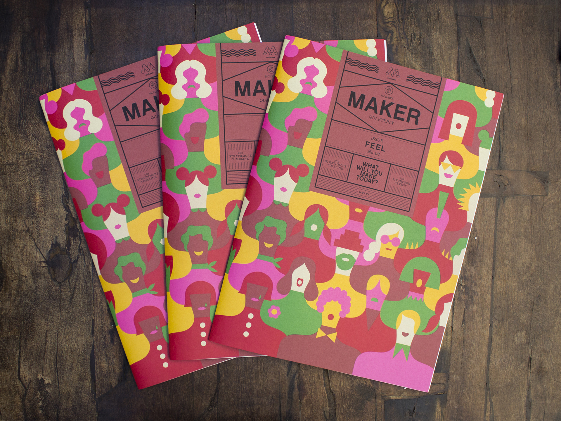Several Maker Quarterly issues laid out on a wood table