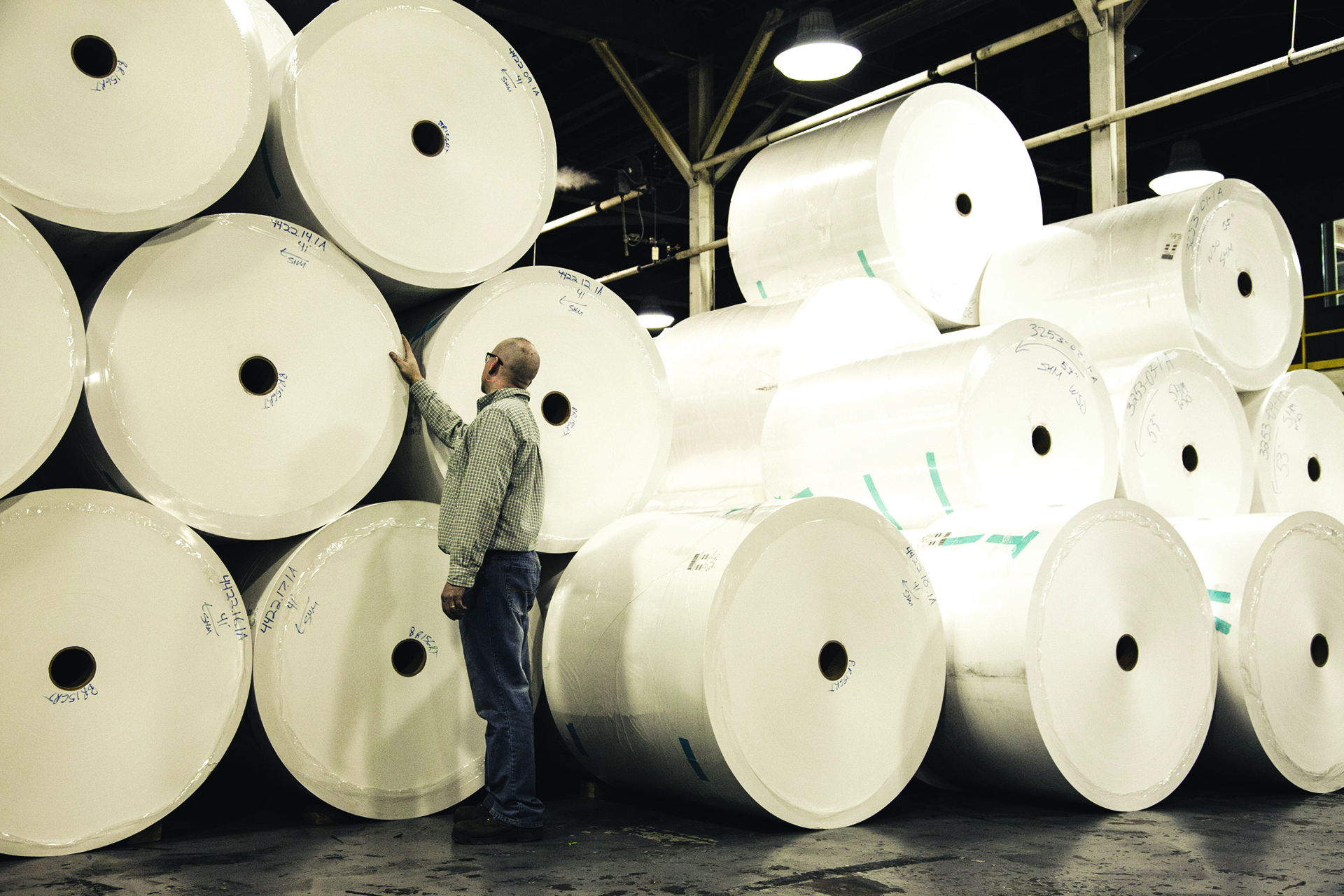 Rolls of Superfine stacked on the warehouse floor