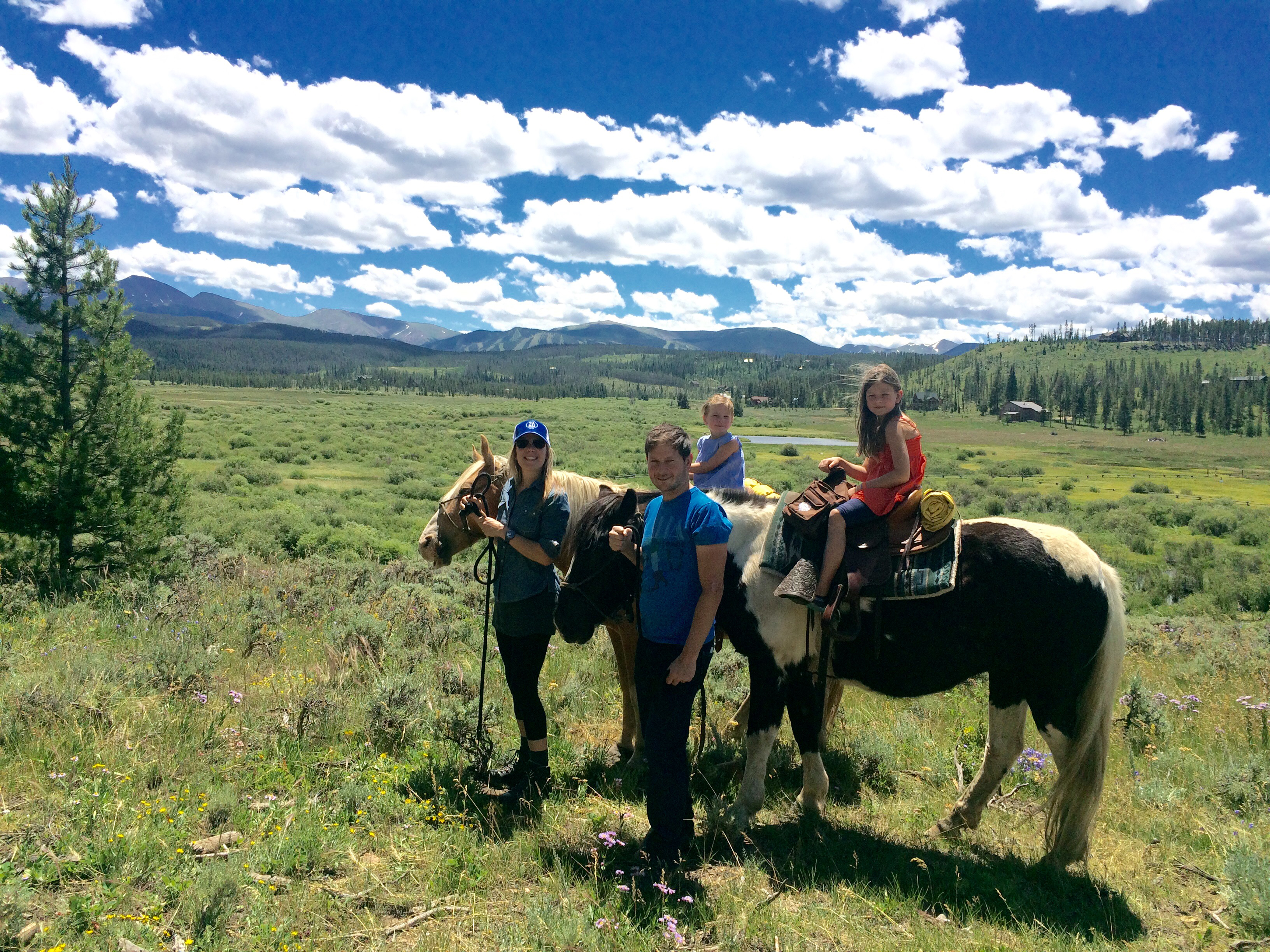 Photograph of Sarah and her family riding horses