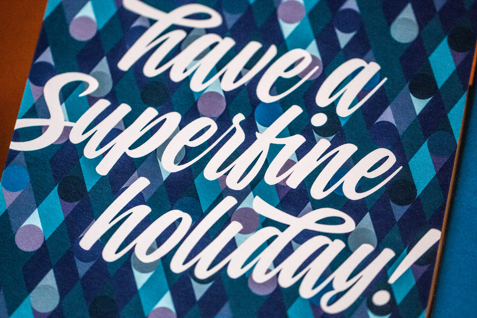 Close-up of the words "Have a Superfine Holiday" in script typography