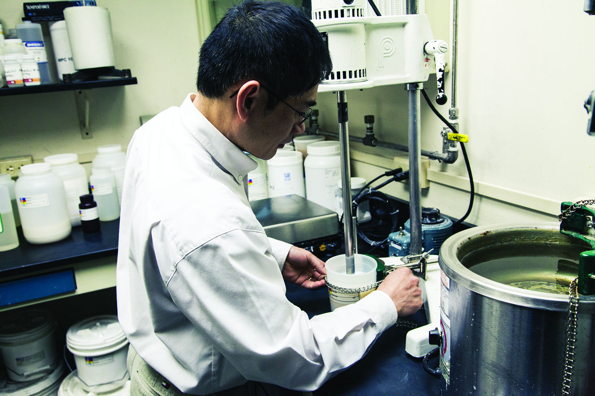 Photograph of a chemist working at Mohawk