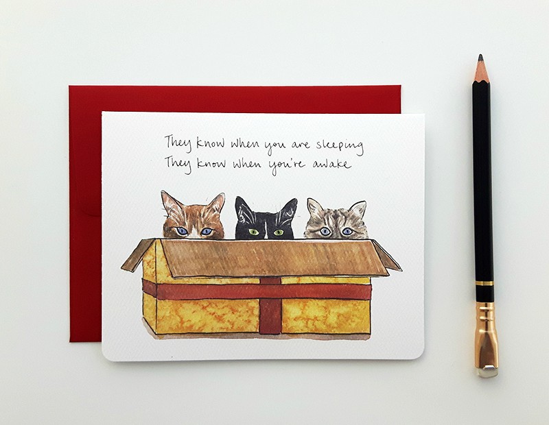 Illustration of cats in a holiday gift box