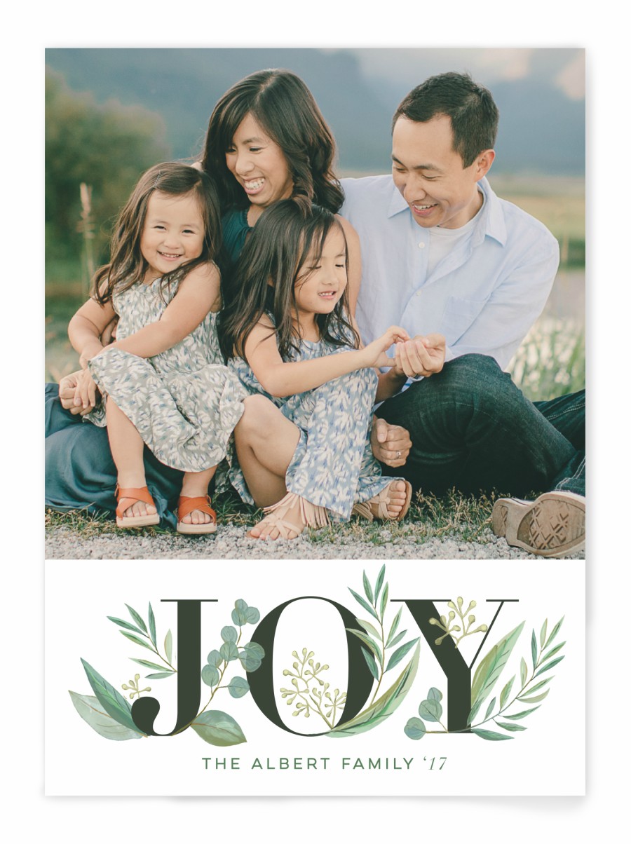 A family photo holiday card with the word "Joy" 