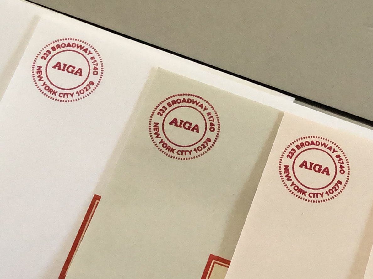 The custom AIGA cancellation stamp printed in the corner of the mailing