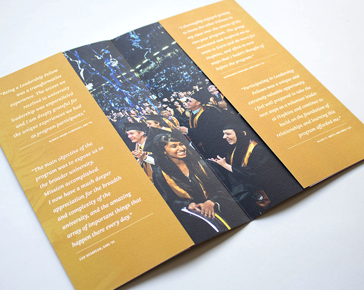 open view of the brochure with photos and typography