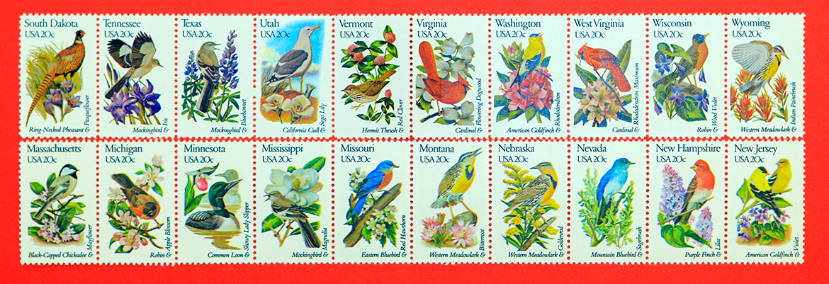 Assorted stamps arranged in rows on a red background
