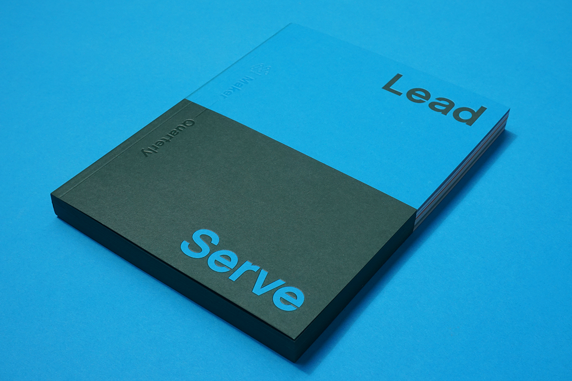 A single copy of Lead and Serve on blue
