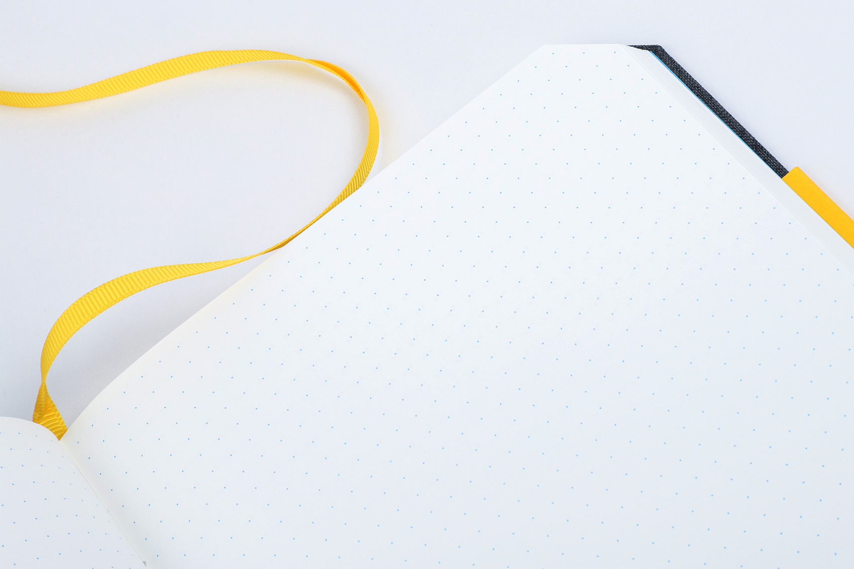 close-up of chronicle notebook page and ribbon marker in yellow