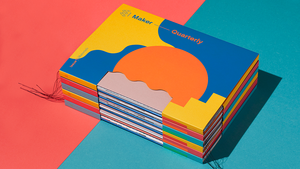 A stack of Maker Quarterly issues on a two-toned background