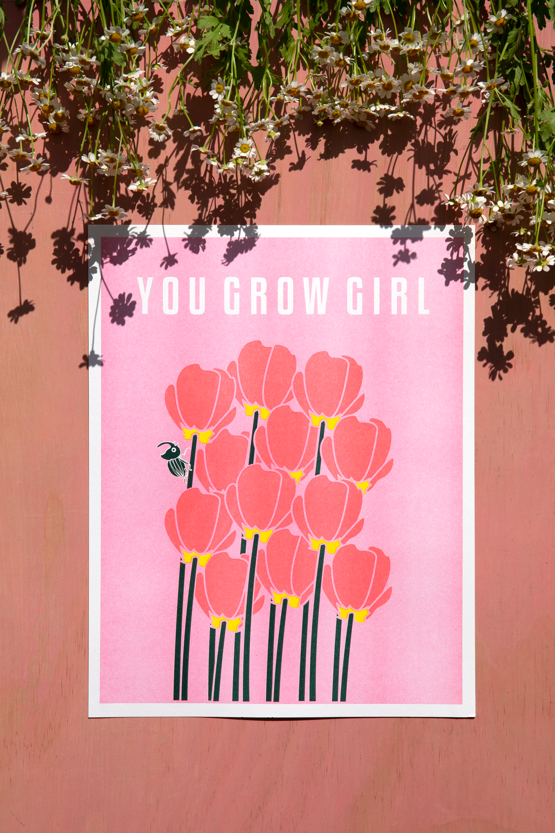 Pink riso print with tulips and typography