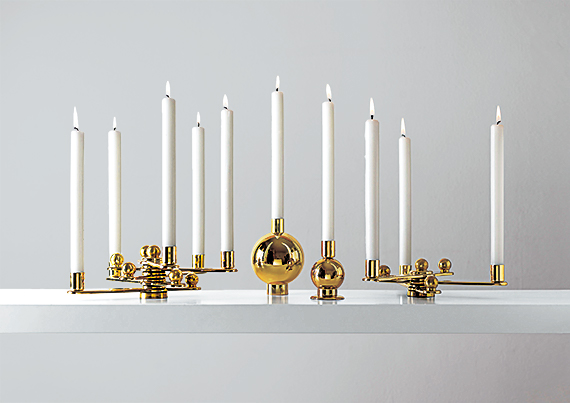 Candlesticks arranged on a white tabletop