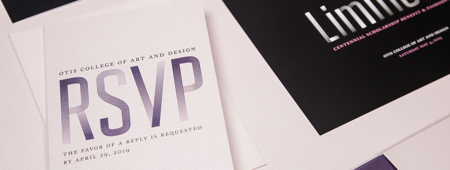 Close-up of RSVP card laying next to an invitation