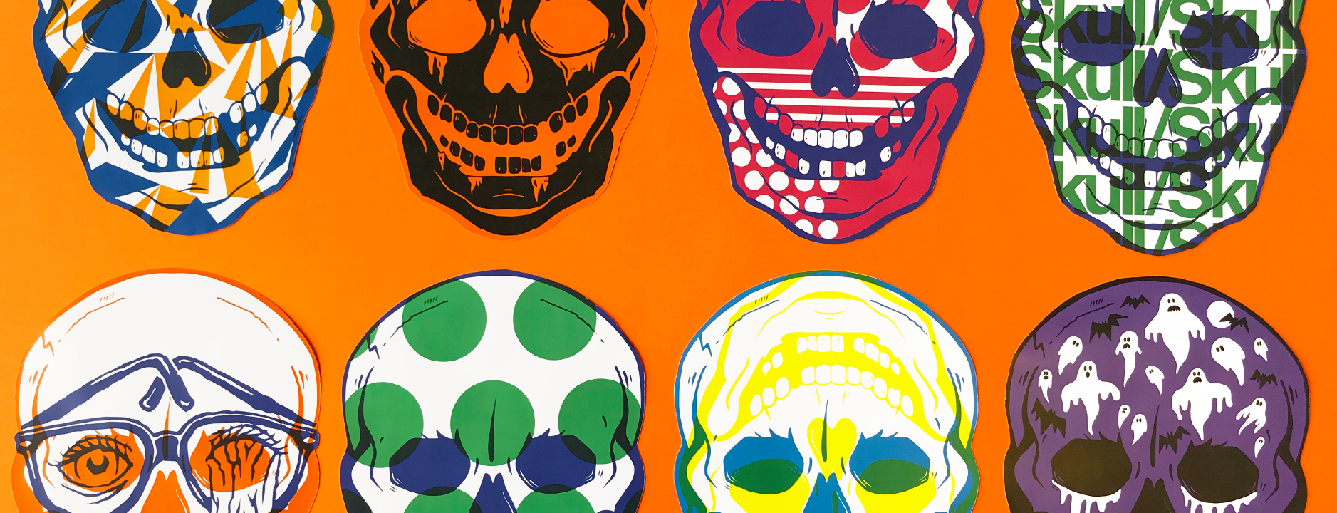 Colorful skulls on an orange background