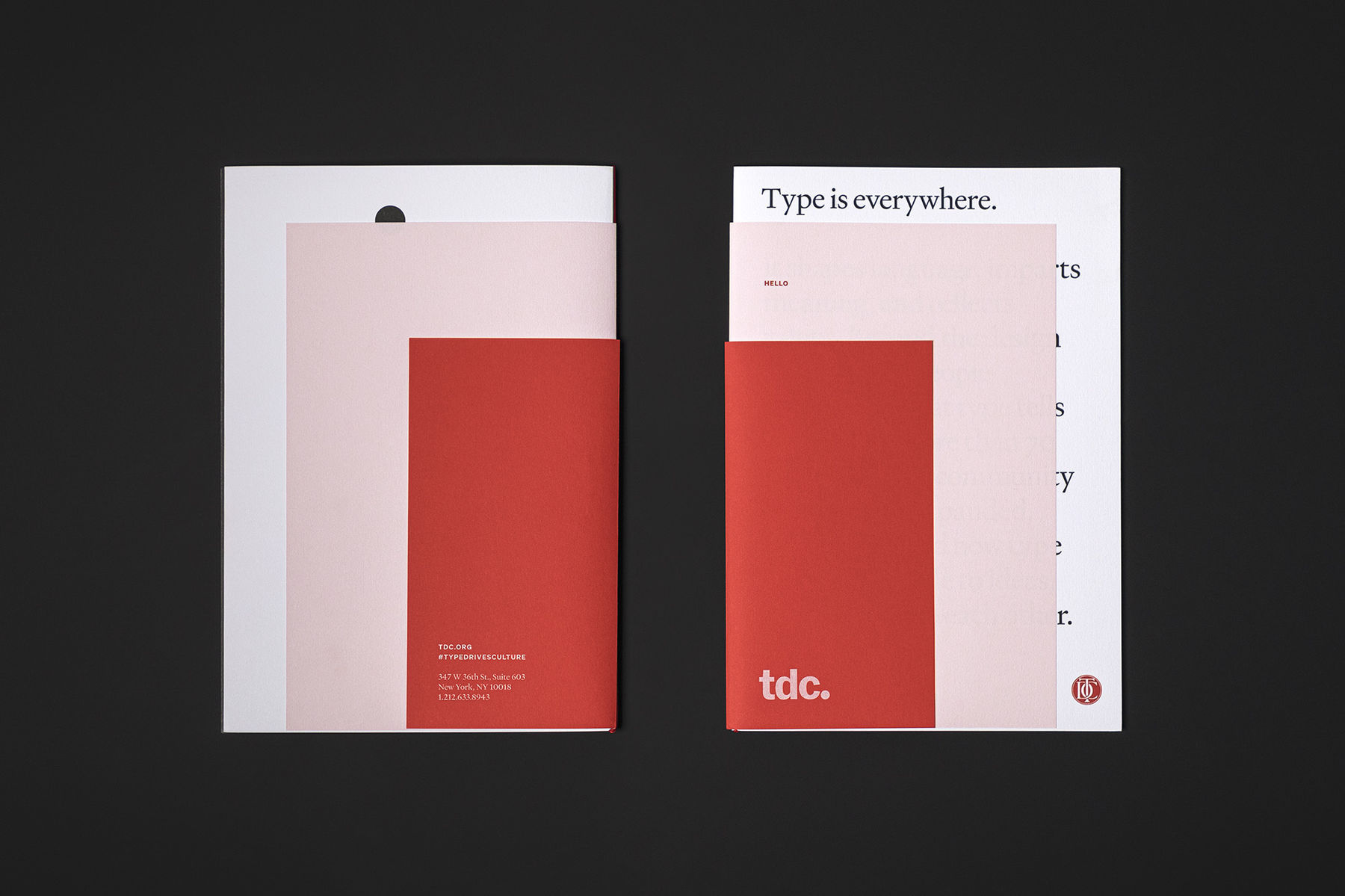 Two Type Directors Club brochures viewed from overhead, showing front and back views