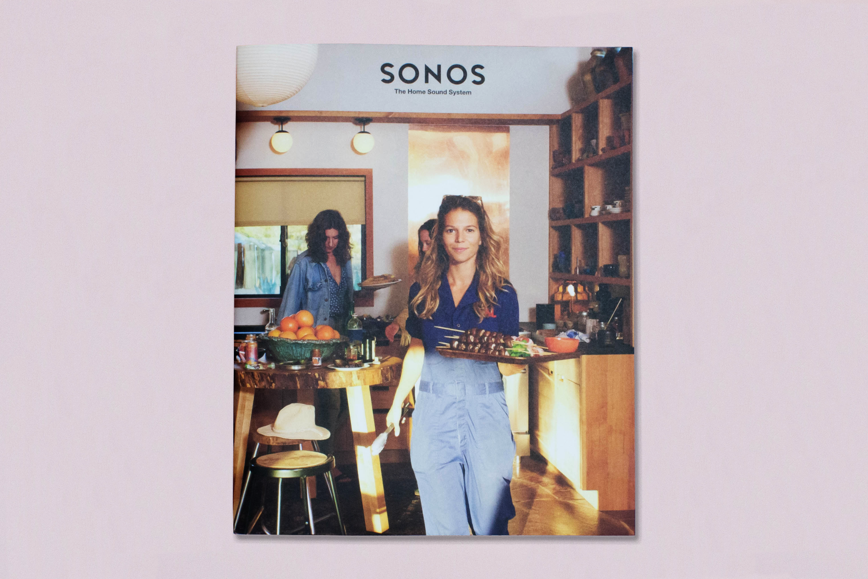 Cover of Sonos brochure on dusty pink backdrop