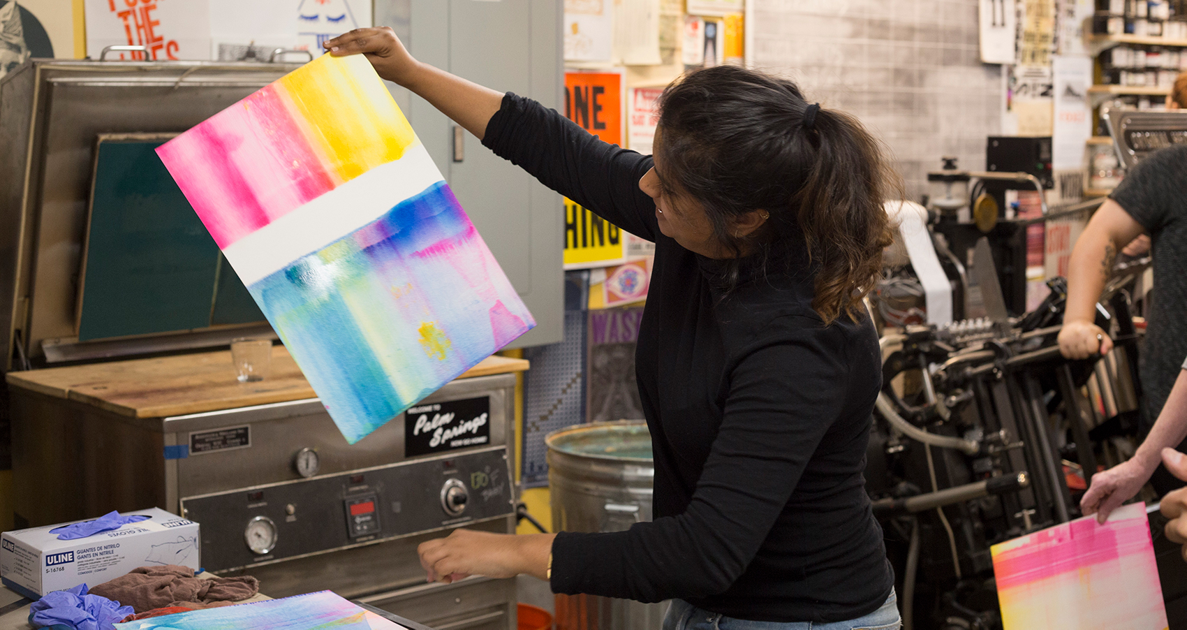 Wide shot of an attendee completing a print