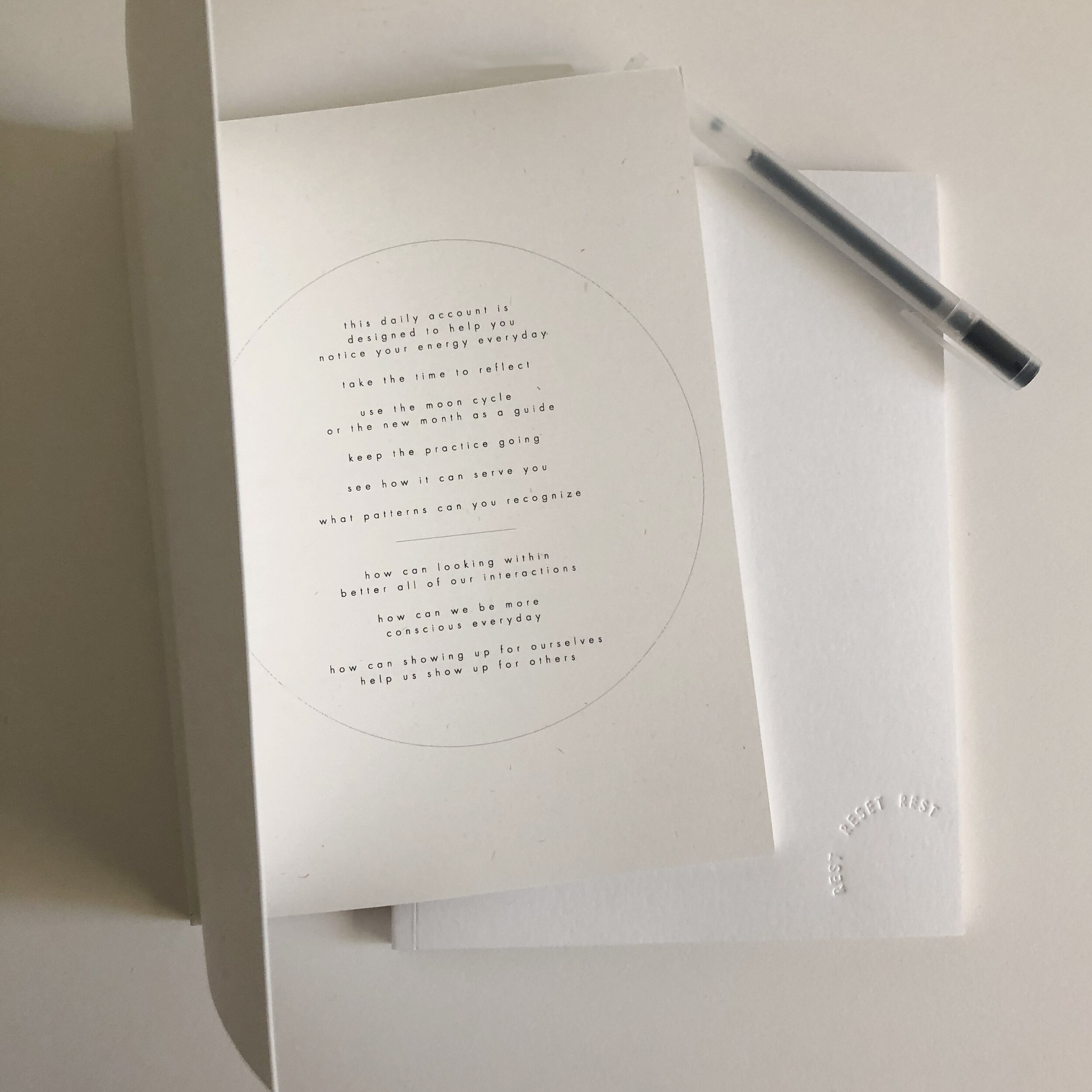 Tiny Bones Press notepad on a white desk