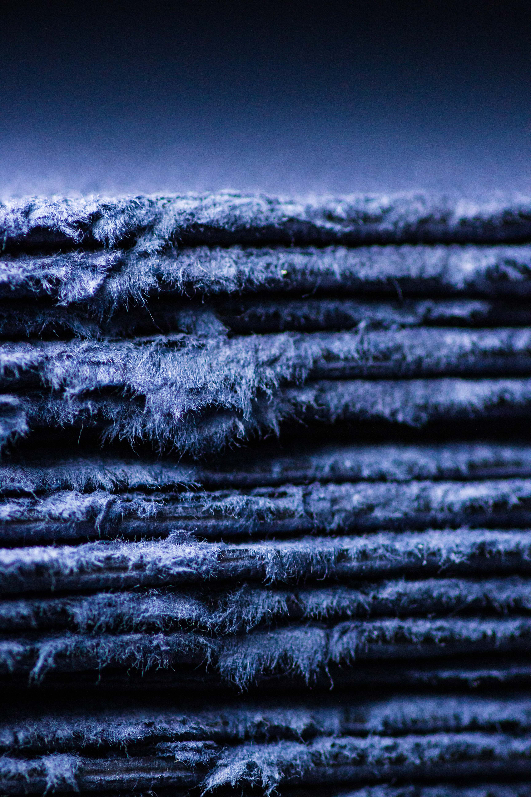 sheets of dried cotton pulp in a denim shade