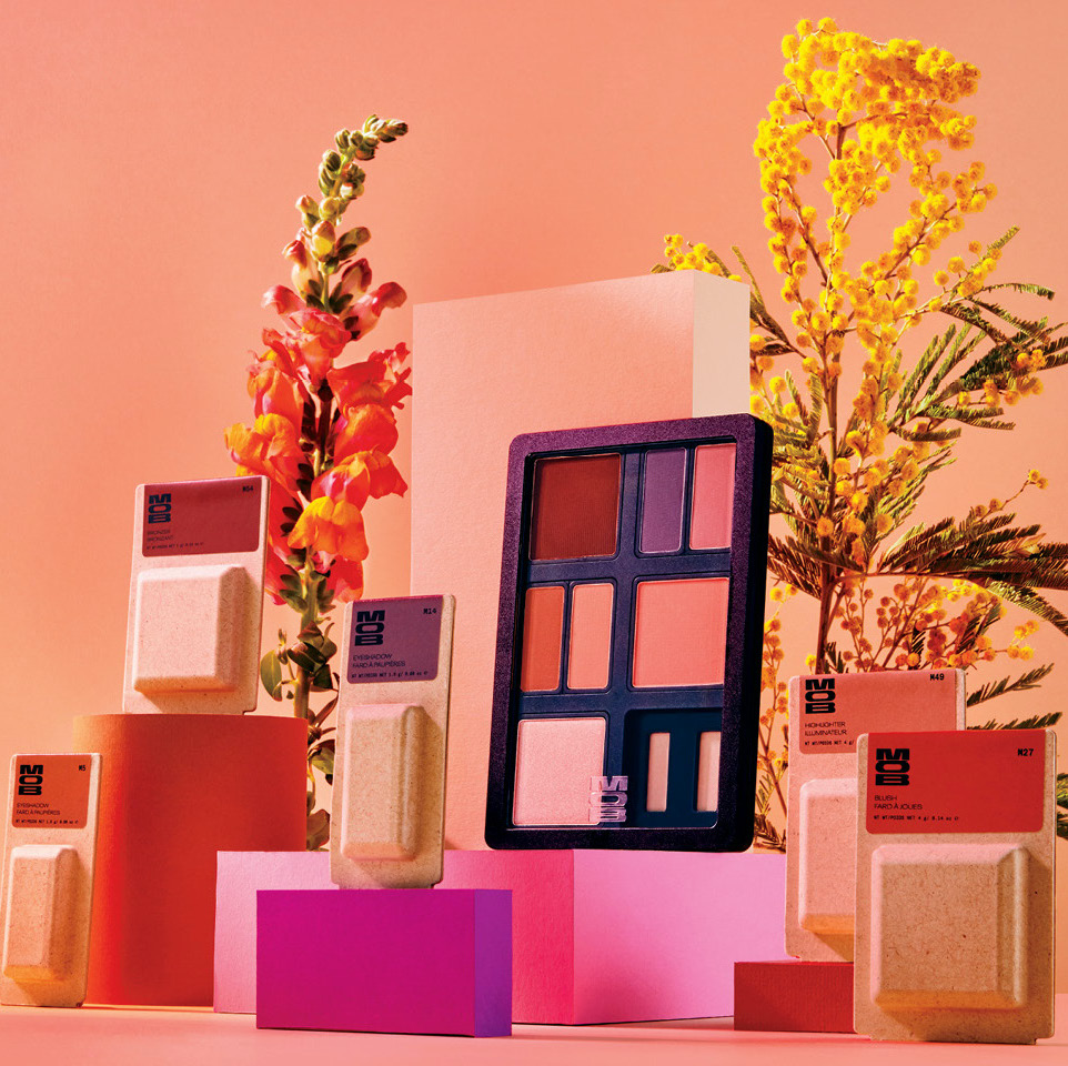 MOB Beauty product shot on pink and orange backdrop with flowers