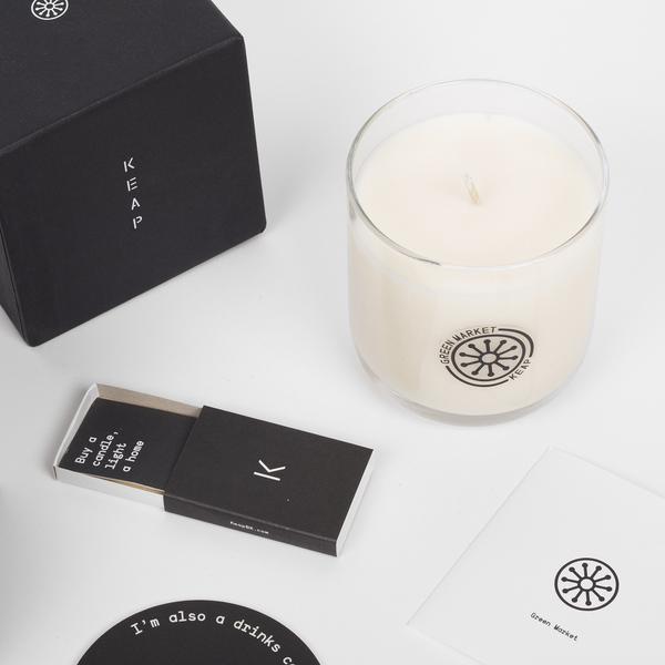 Candle and packaging on a white table