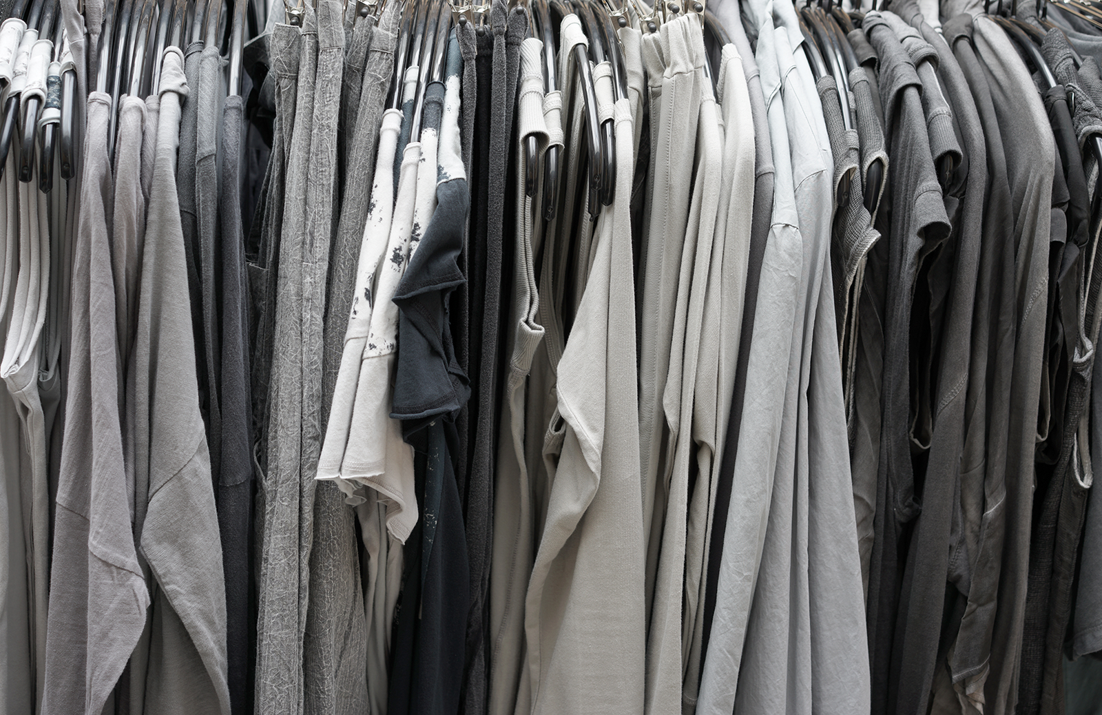 t-shirts hanging on a rack