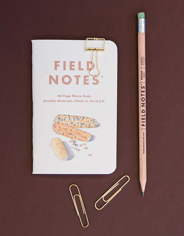 field notes book with office supplies