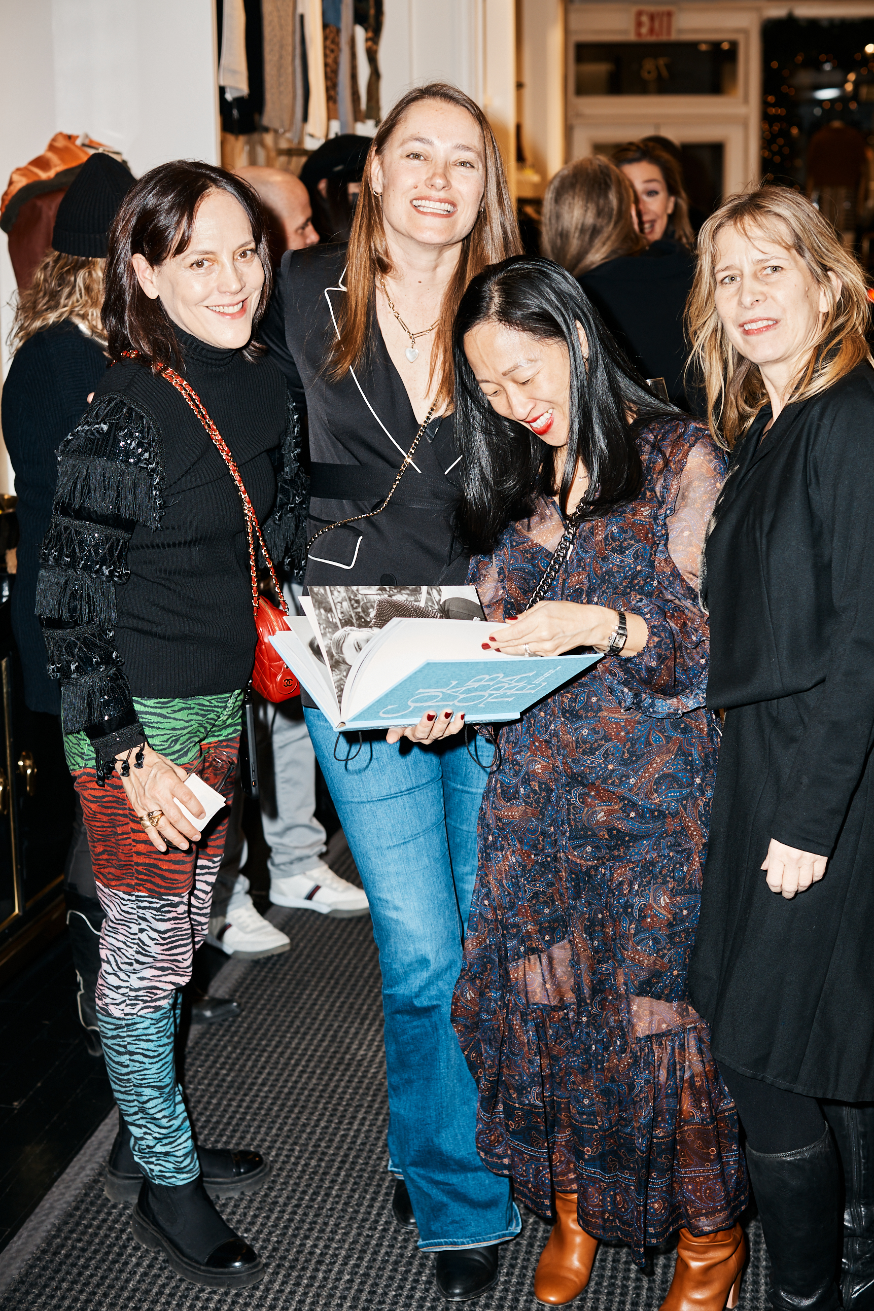 Kristy Hurt surrounded by guests at her book launch