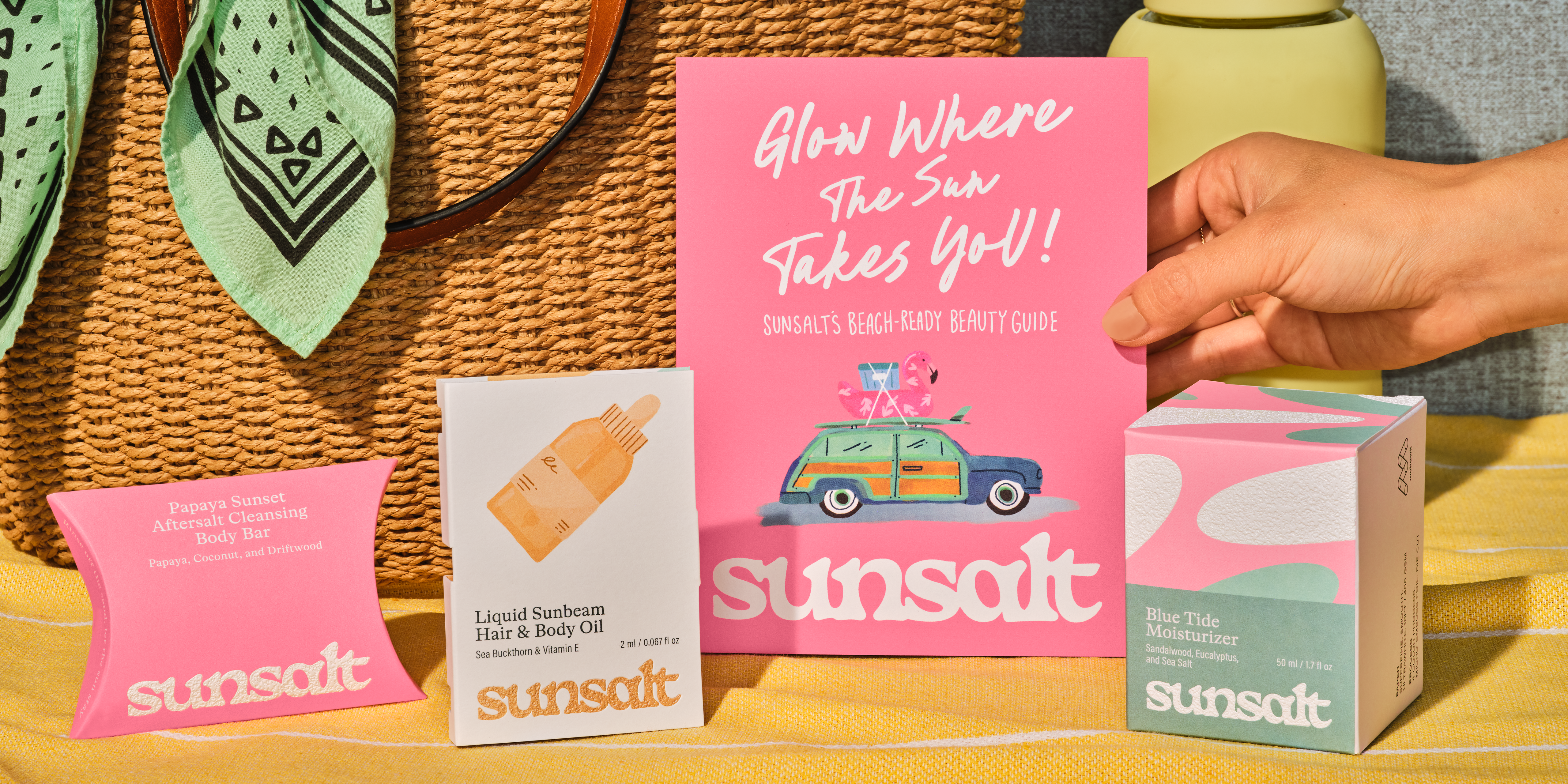 Sunsalt brand components displayed on beach blanket