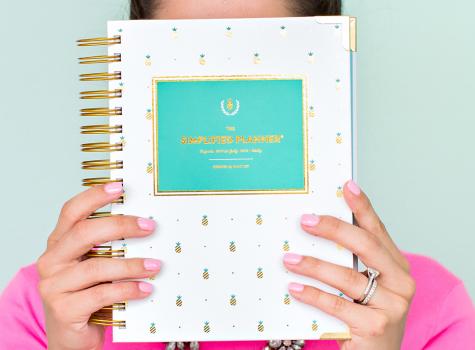 Hands holding a planner