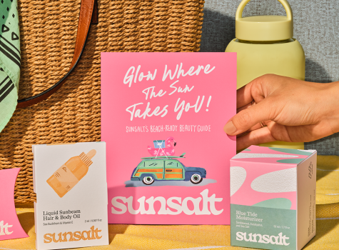 Sunsalt brand components displayed on beach blanket